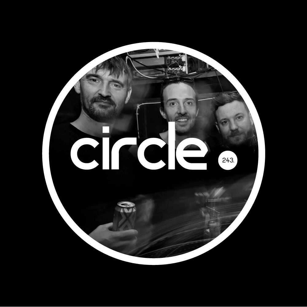 Black-and-white Circle 243 cover artwork featuring Brent Lawson, Pete Bidwell and Jonny Burg together at Blue Mountain, framed by a large white circle with the word “circle.” across the image.