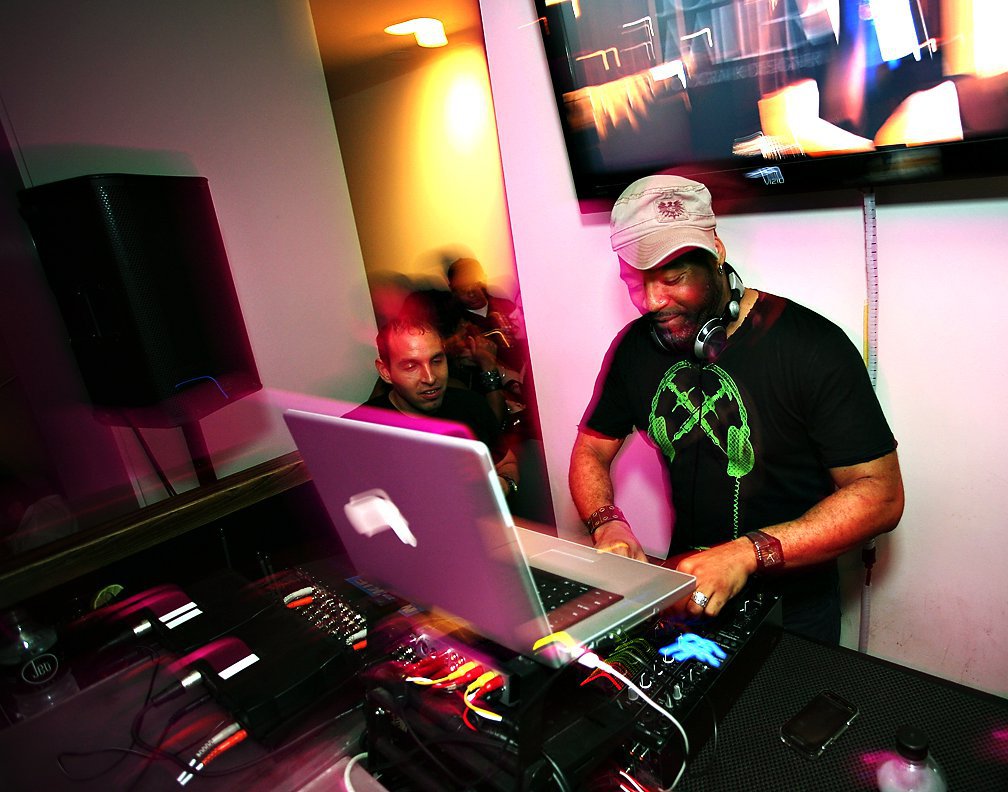 American DJ Foxx performing at an event, colour image.