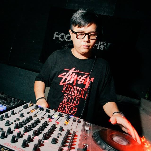 Malaysian DJ and producer Terence C performing at event, colour image.