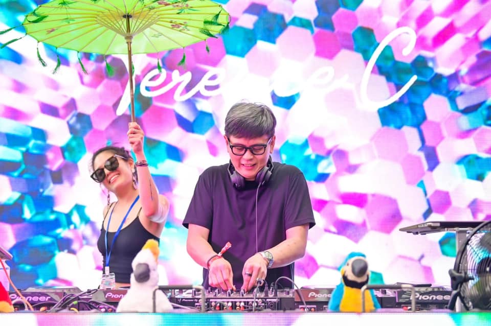 Malaysian DJ and producer Terence C performing at an event, colour image.