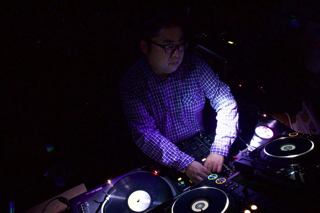 Japanese DJ Marcy performing at a Bar in Okinawa, colour image.