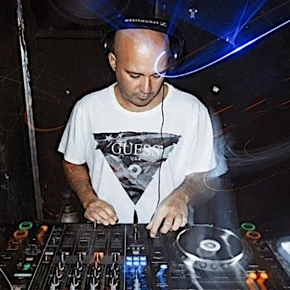Argentinian DJ and producer Carlos Gatto performing at an event in Argentina, colour image.