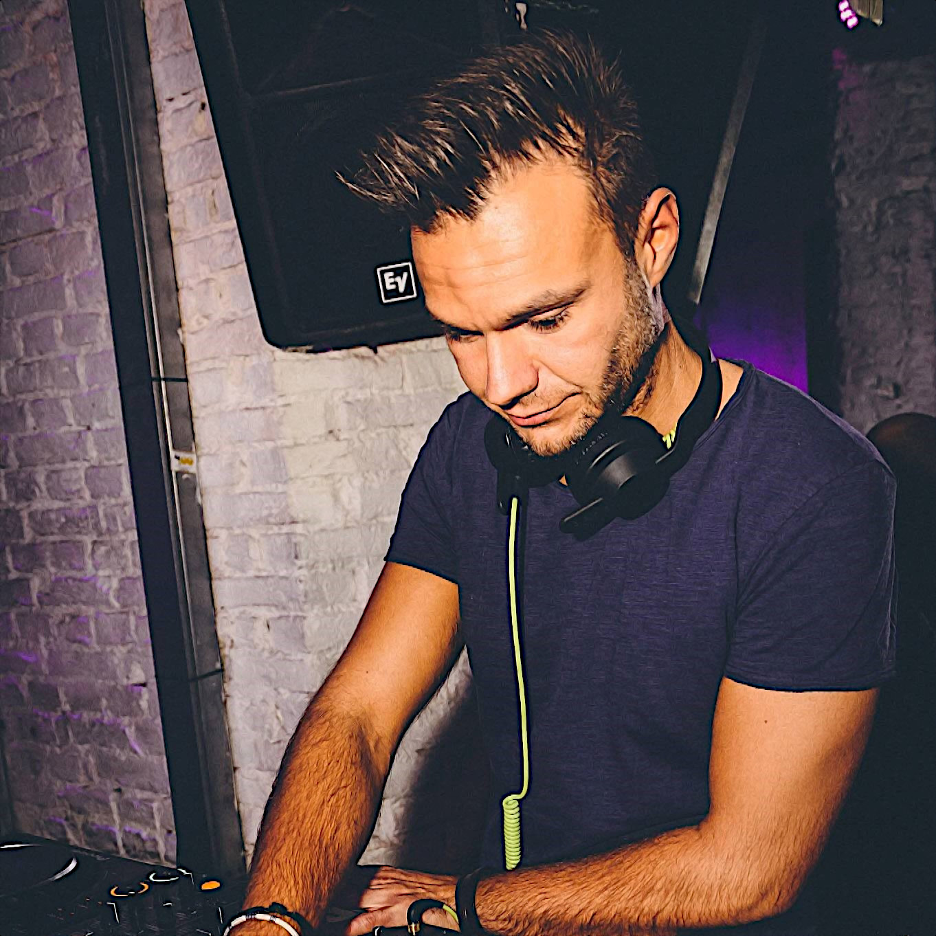 Italian DJ and Producer Andrea Mirgone performing at Zettel club, colour image.