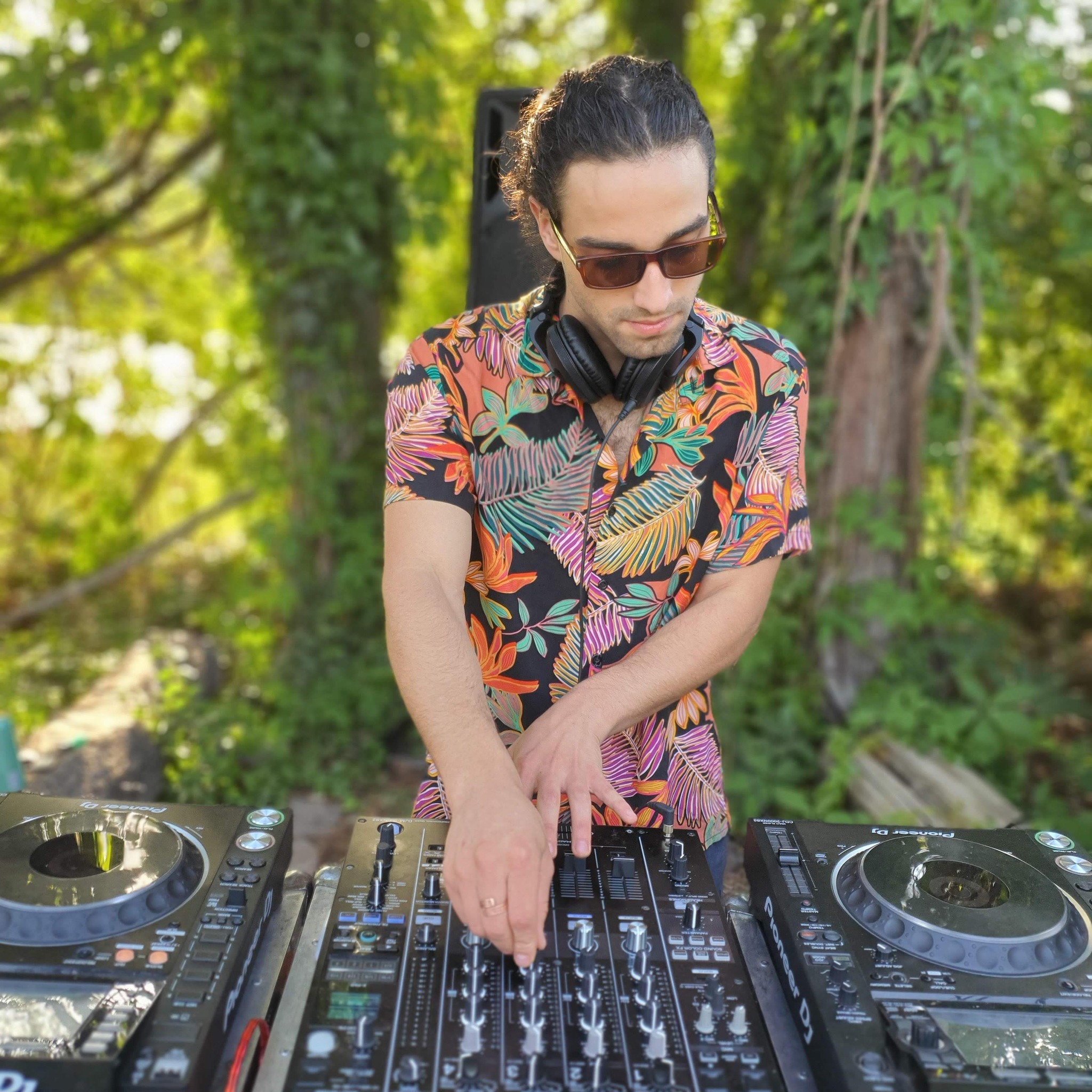 Argentinian DJ and producer IGCIØ performing at an outdoor event, colour image.