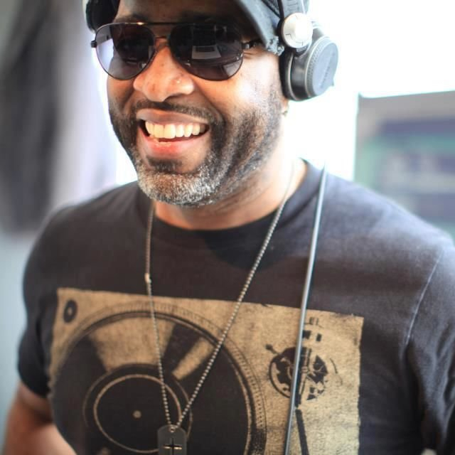 American DJ Foxx smiling at camera in upper body shot, colour image.