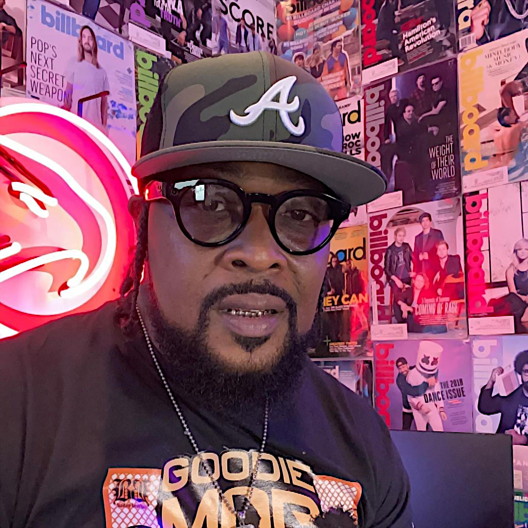 United States Rapper and producer Khujo Goodie wearing a baseball cap in Billboard studio, colour image.