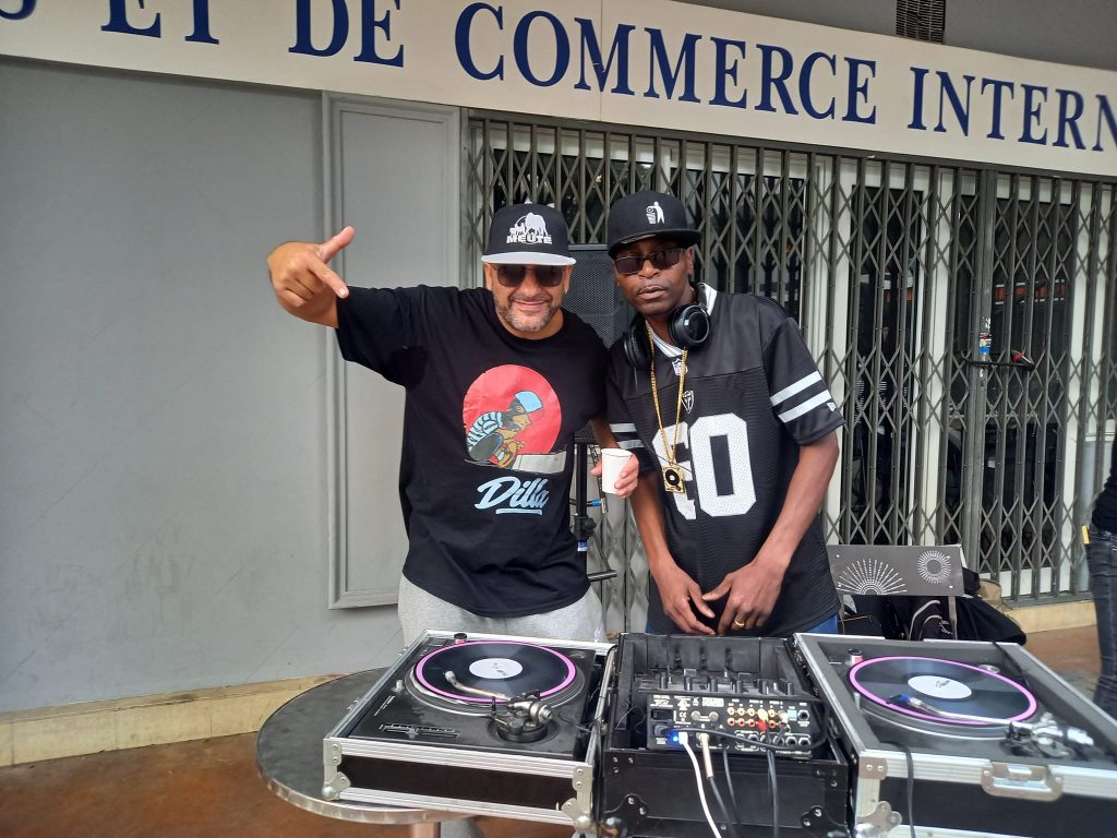 DJ Ronsha & G-Zon performing in the street in Paris, France, colour image.