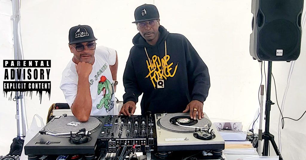DJ Ronsha & G-Zon performing at Île au Cointre in France, colour image.
