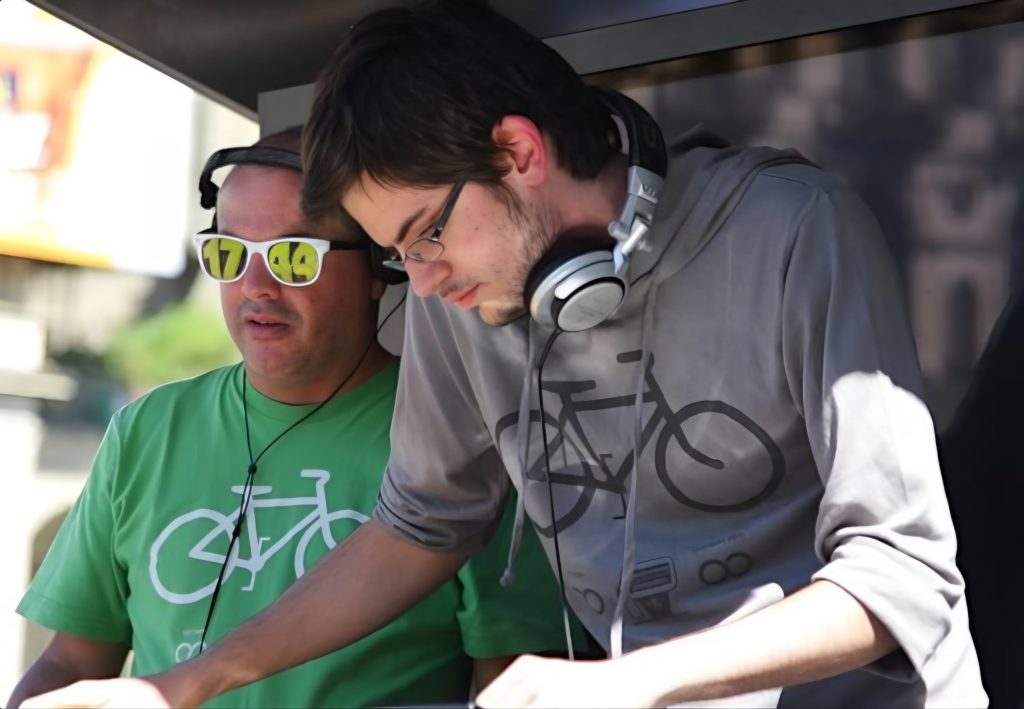 Italian DJs and producer Bicycle Corporation performing as a duo at an event, colour image.