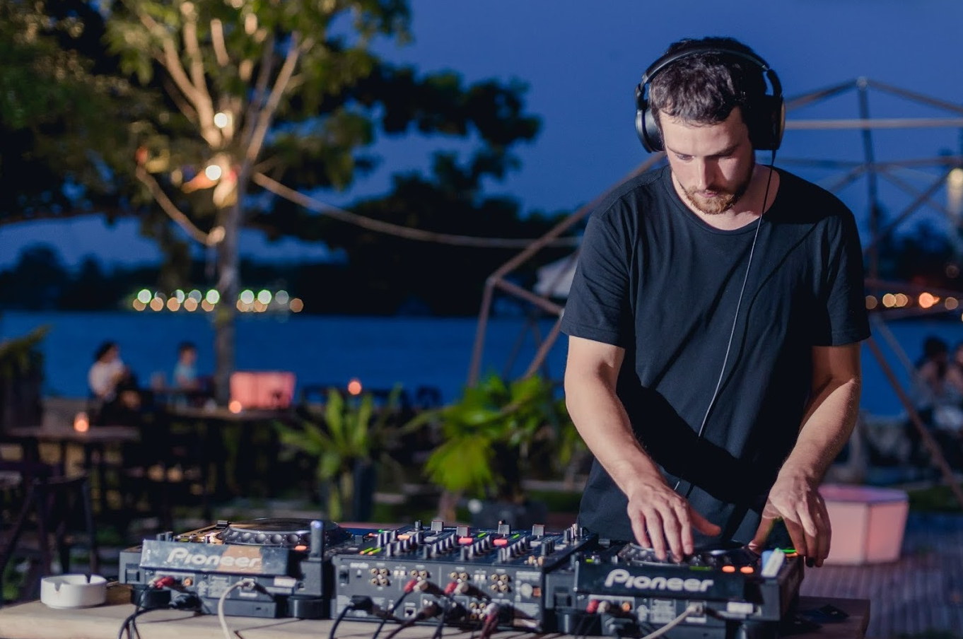 Irish DJ and producer Hugh Def performing outdoors on Pioneer CDJs and Pioneer Mixer.