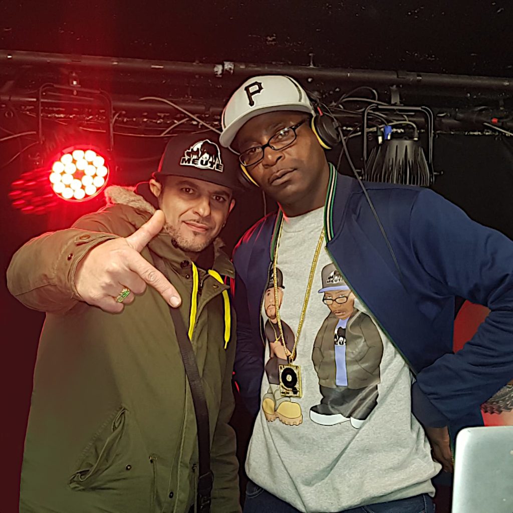 DJ Ronsha & G-Zon in a photo shoot in a hip-hop club in Paris, France, colour image.