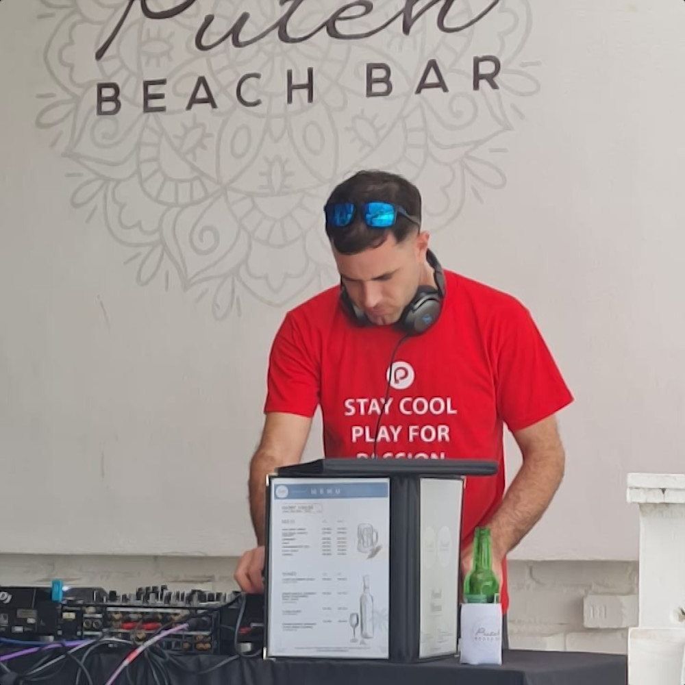 British DJ and promoter Dimensions performing at Puteh Beach bar in Malaysia, colour image.