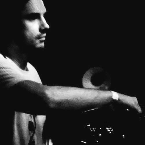 Russian DJ and producer Alexander Filatov performing as a DJ side picture in black and white.