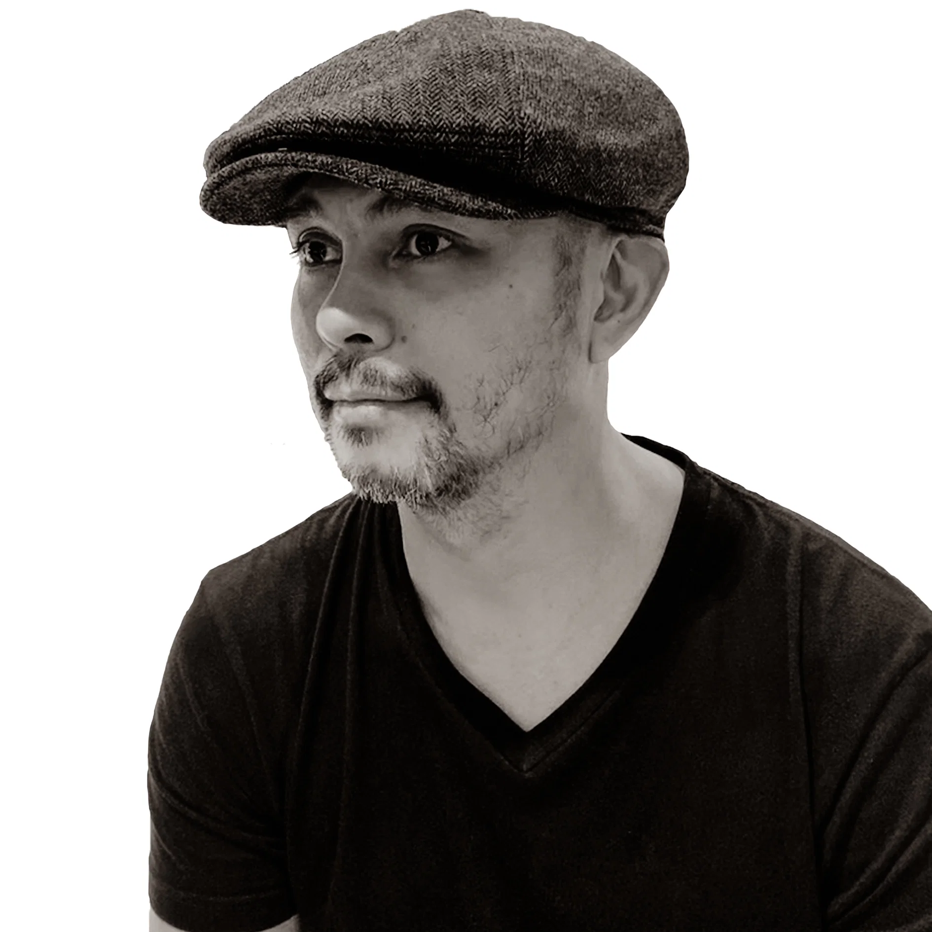 Black-and-white profile portrait of Filipino DJ and producer Herb Cabral wearing a flat cap, representing his work across House, Techno, Deep House, Afro House and Melodic House and Techno.