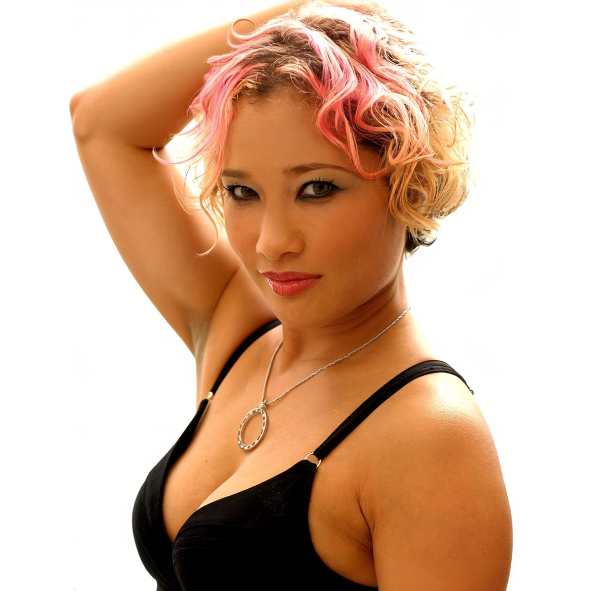 Suzy Solar, trance and progressive house DJ and producer from Florida, in a promotional portrait with pink-tipped curly hair against a white background.