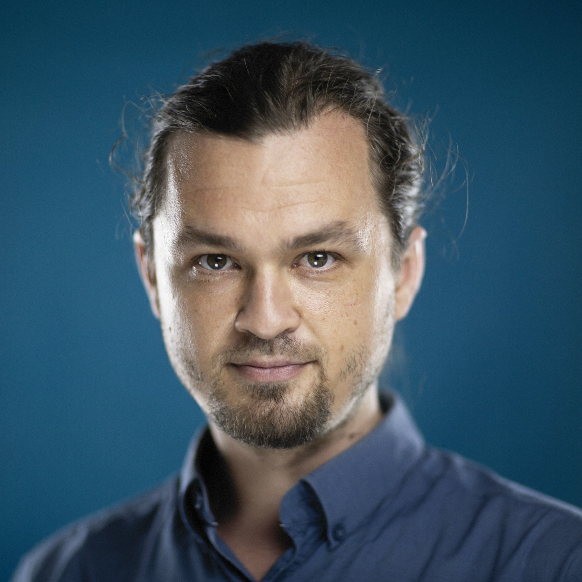 Russian DJ and Producer Vakabular smiling whilst looking at camera.
