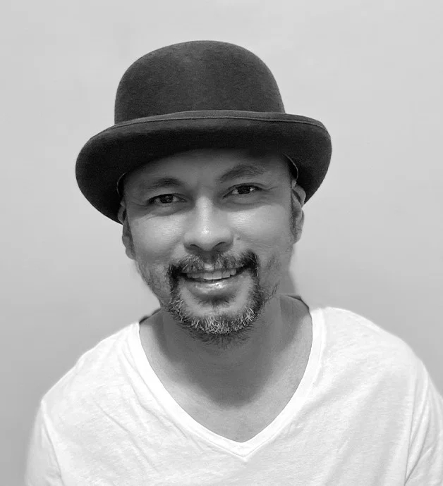 Black-and-white portrait of Filipino DJ and producer Herb Cabral wearing a bowler hat, representing his work across House, Techno, Deep House, Afro House and Melodic House and Techno.
