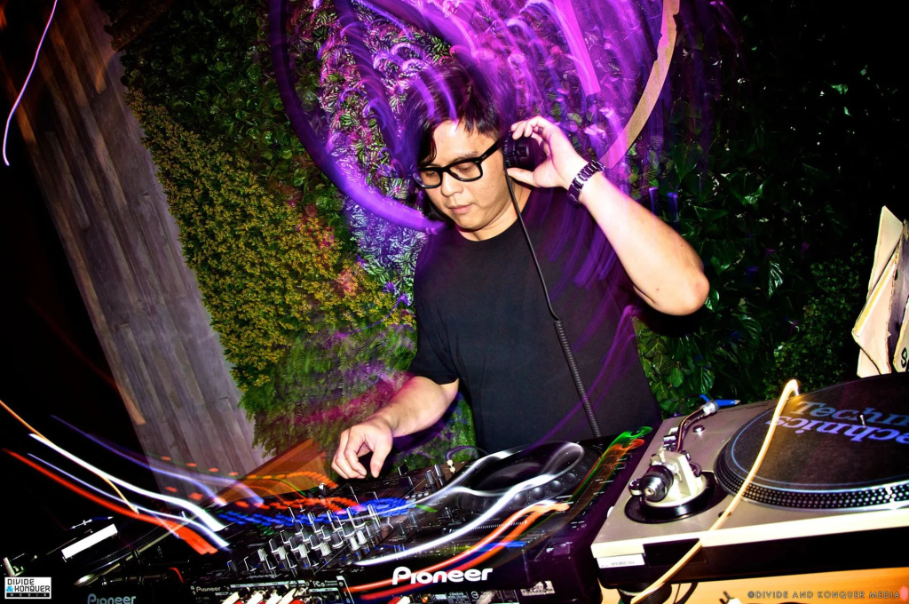 Malaysian DJ and producer Terence C performing at an event, colour image.