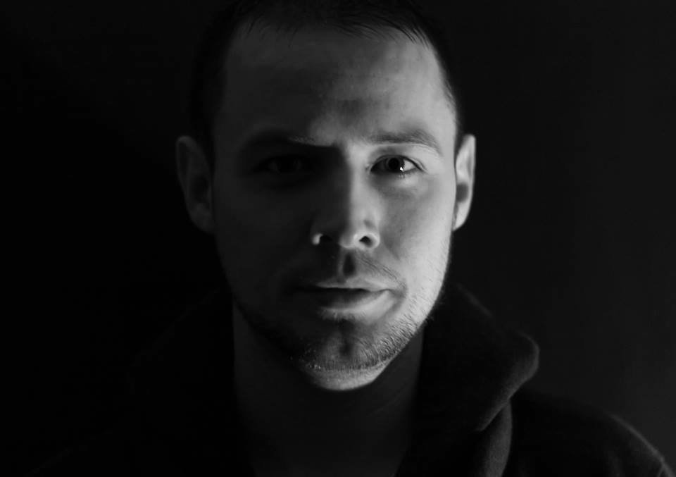 Irish DJ and producer William Byrne standing facing camera head shot in black and white.