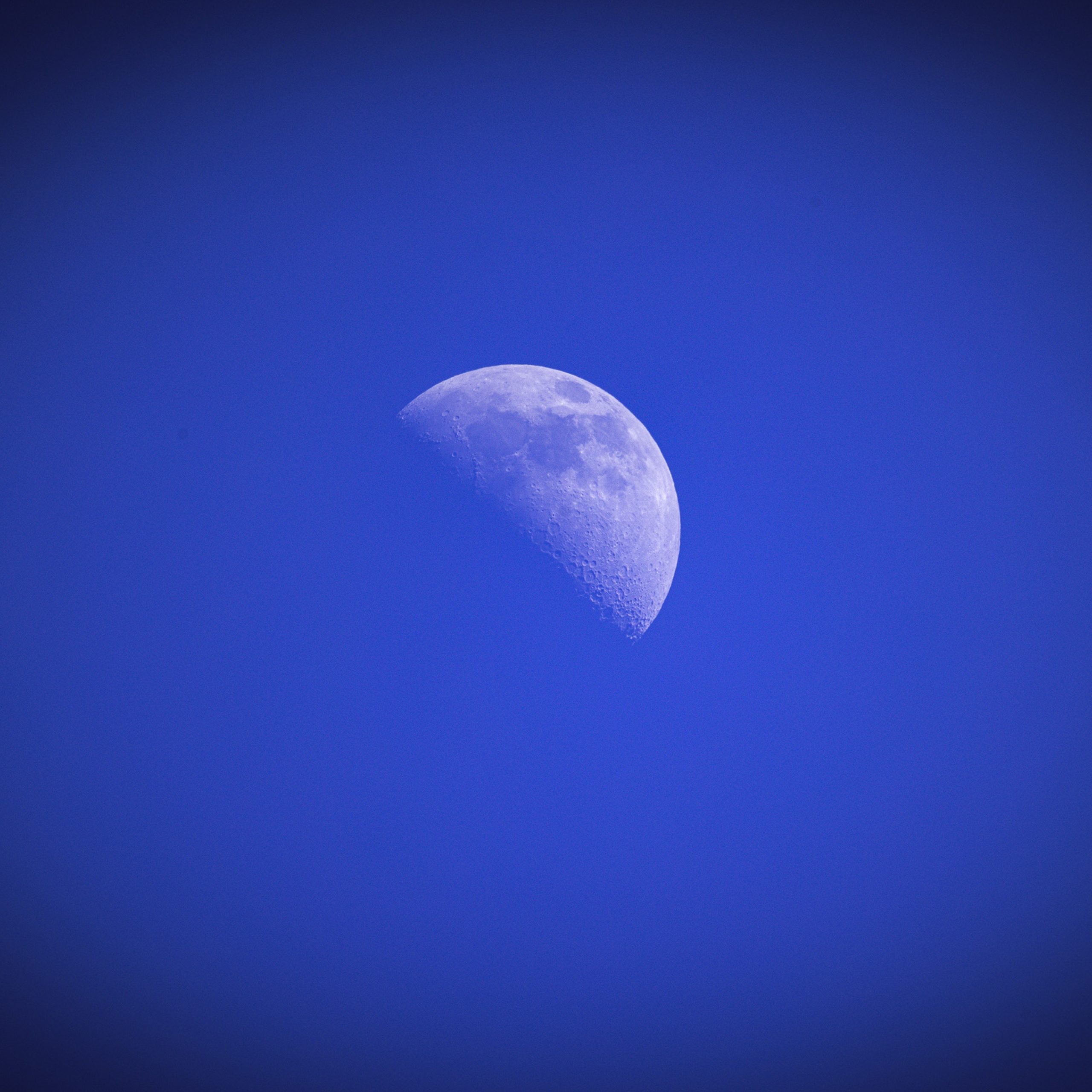 Artwork for Killian Walsh’s track Let’s Play Bongos featuring a detailed half moon surrounded by deep blue haze and atmospheric tones against a dark background.