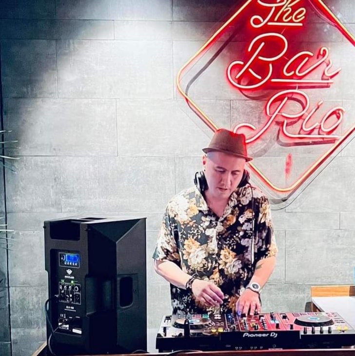 Filipino DJ and Producer Tony Pavia performing at an event, colour image.