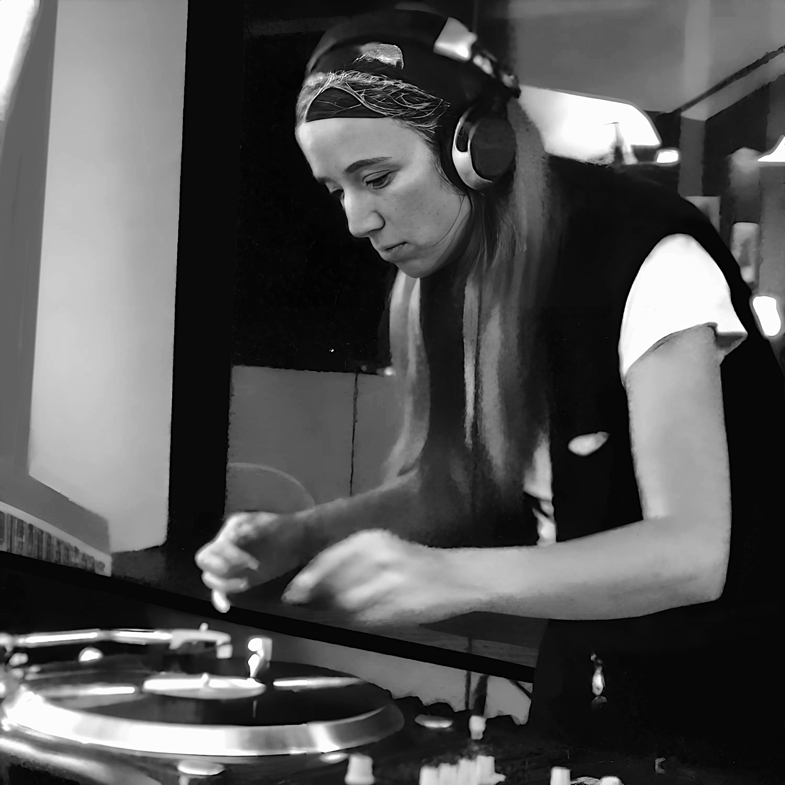 German DJ and producer Stani Stern performing on Vinyl Turntables, black and white image.
