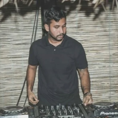 Sri Lankan DJ Mavvwa performing at an event in Sri Lanka using Pioneer CDJs, front image in colour.