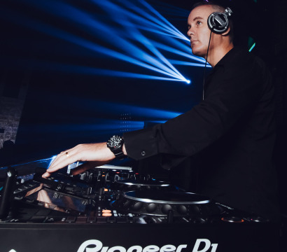 Andrew M performing as a dj at an event on Pioneer CDJs.