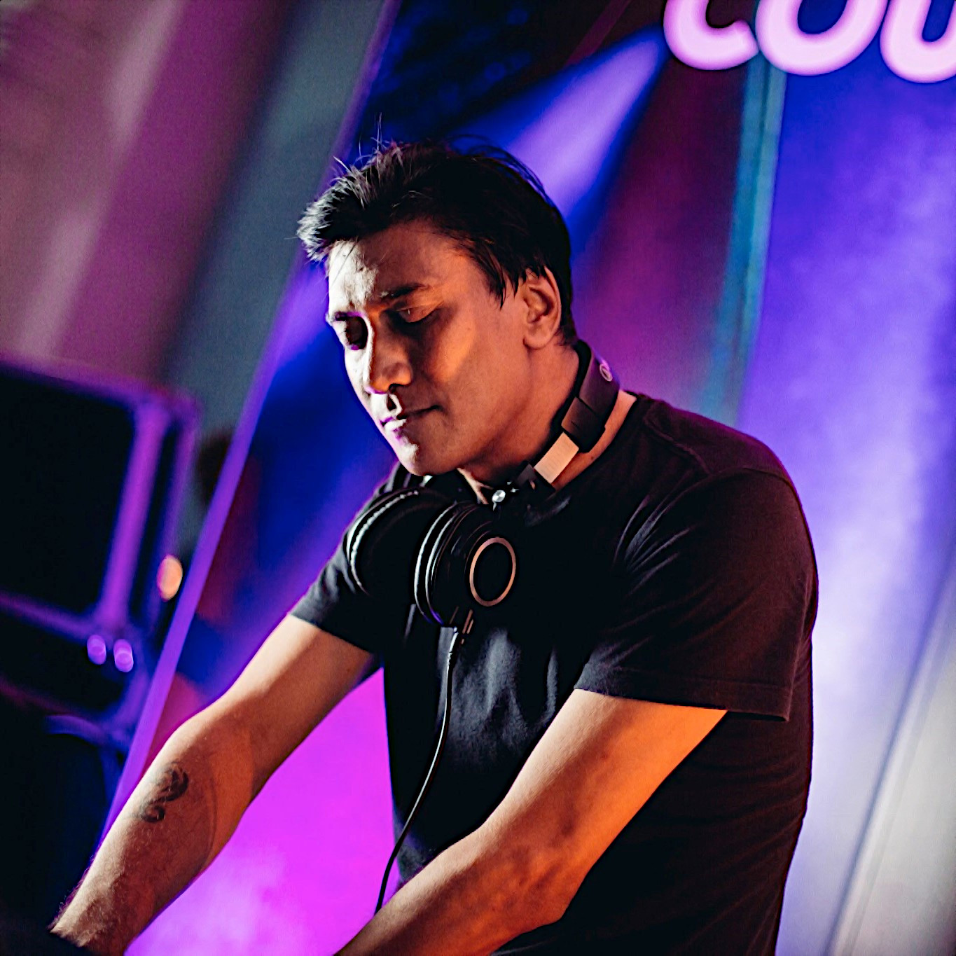 Singaporean DJ and producer Brendon P performing at the Singapore Art Gallery, colour image.