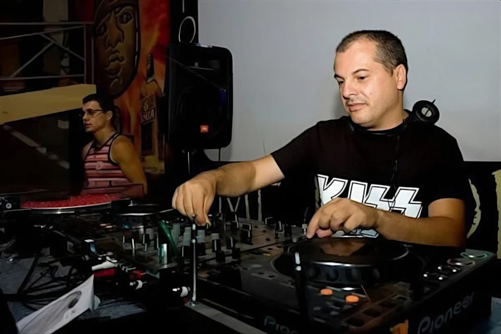 Marco Mei performing at an event in a side profile picture, colour image