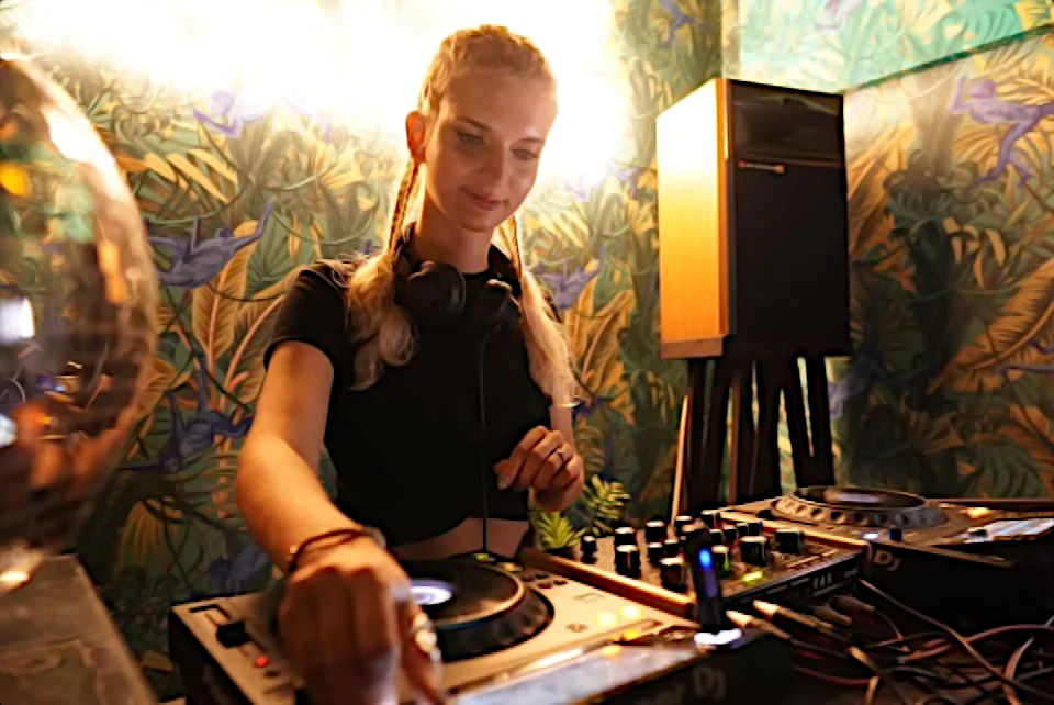 Russian Dj Cocasova performing at an event in Vietnam, colour image.