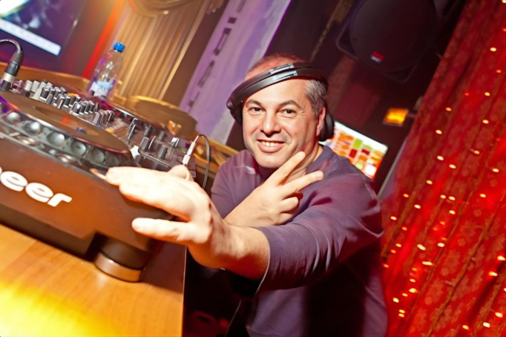 Italian DJ and producer Marco Mei performming at Rafinad Club, colour image.