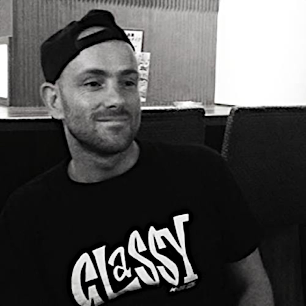 British DJ Matt Ferenzi smiling and looking left, black and white image.