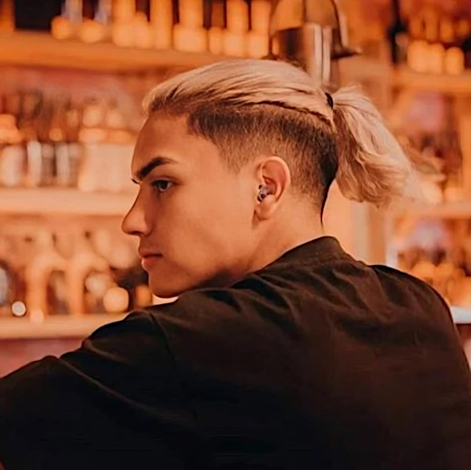 Dilan Aristizabal, also known as Bralan, is shown in a promotional portrait for The Lab Sessions with his back to the camera, glancing to his left in a color image.