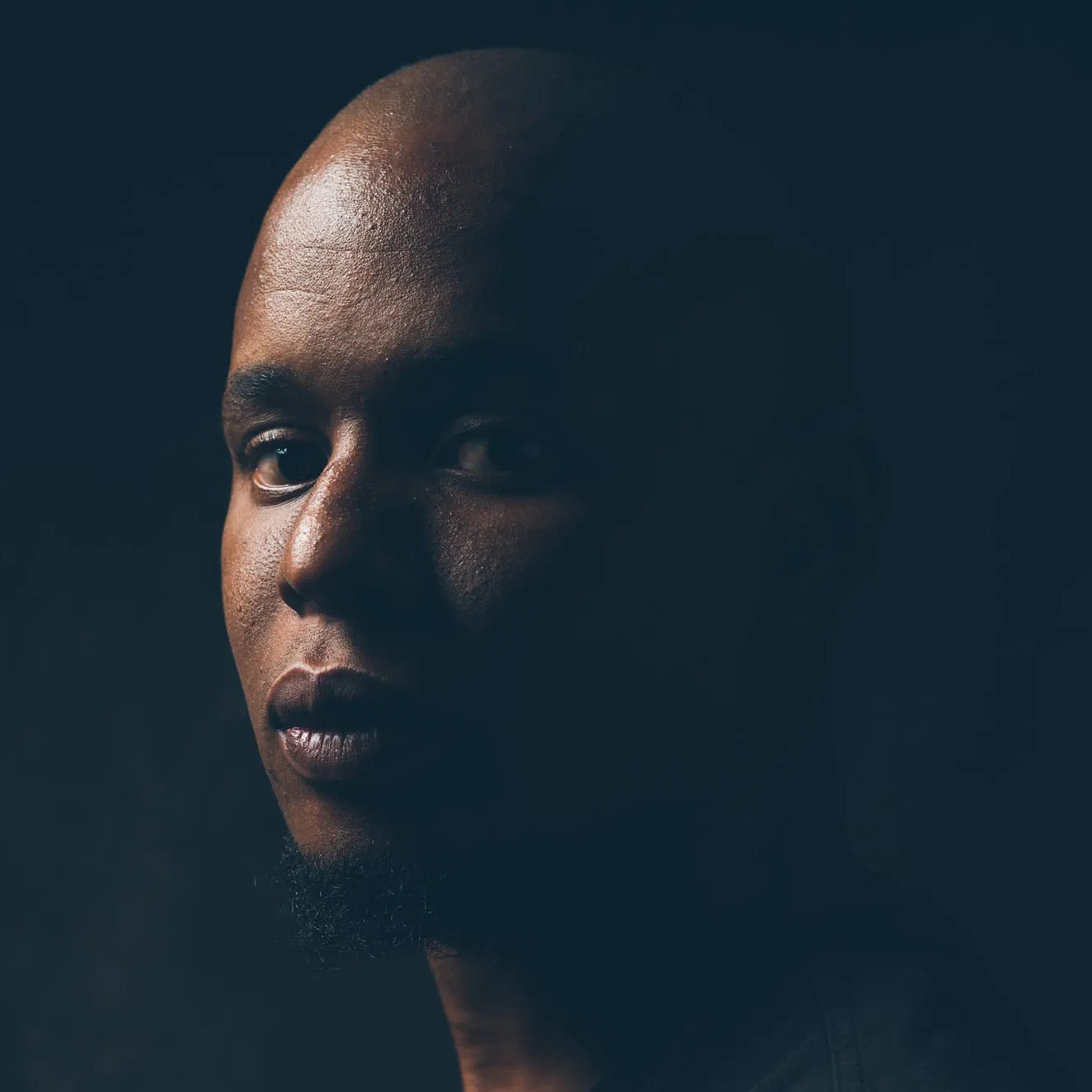 South African DJ and producer Owami Umsindo in head shot, colour image.