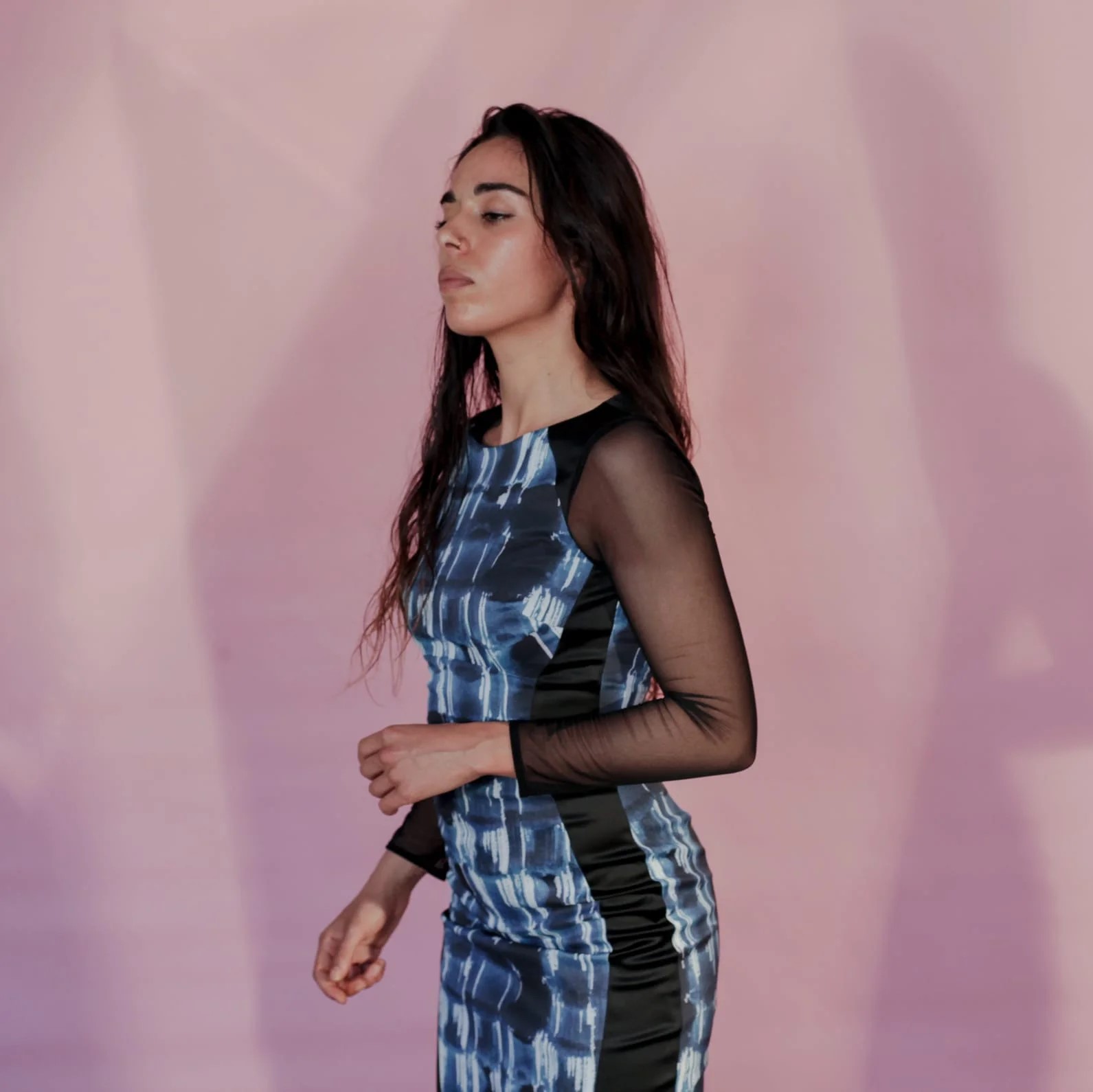 French DJ and Producer Camelia looking and facing to her right wearing a dress, colour image
