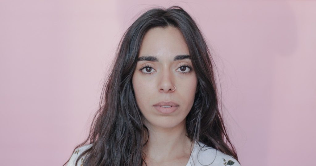 French DJ and producer Camelia looking directly at camera, colour image.