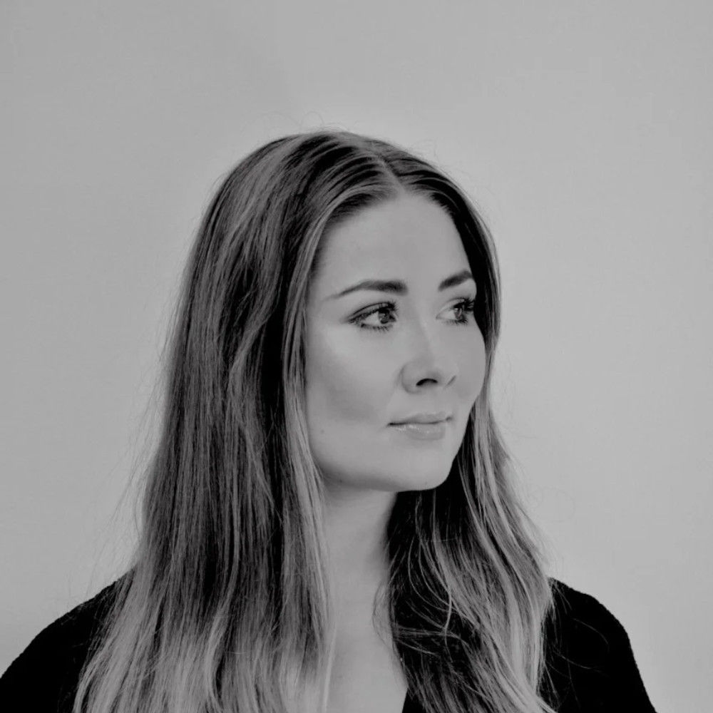 Finnish DJ Marsii standing in headshot looking left, black and white image.