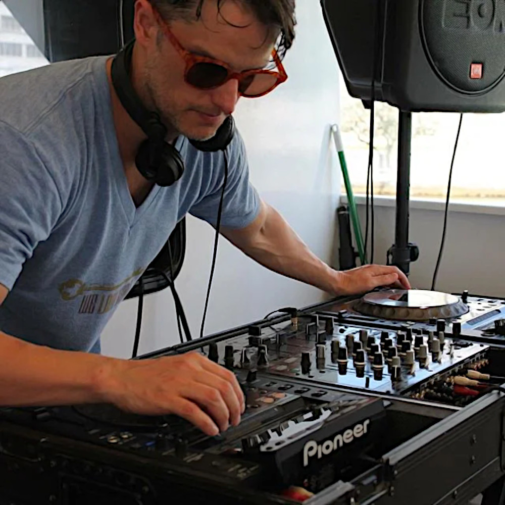 American dJ and producer Parrado performing on Pioneer CDJs and Mixer at an event in Miami, colour image.