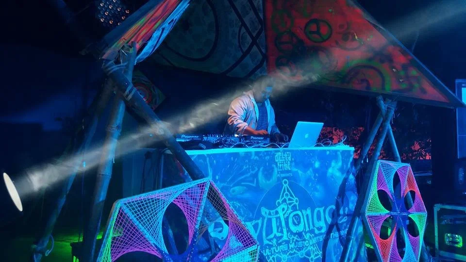 Bangladeshi DJ and producer Dr Moonstruck performing at an event, colour image.