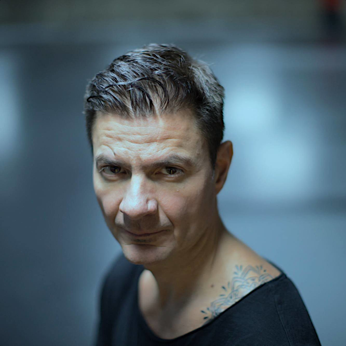 Belgian DJ and producer Dava Di Toma looking at the camera with a serious face, colour image.
