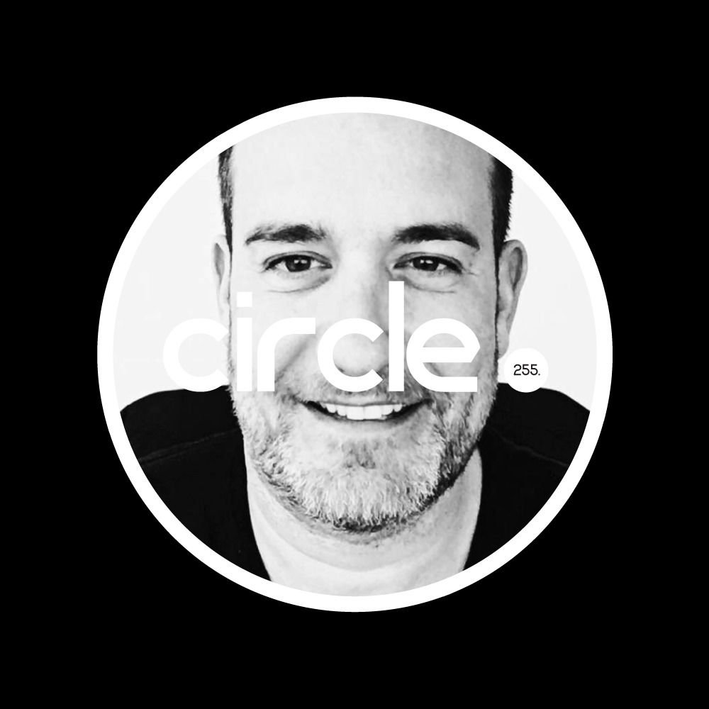 Menkee behind circle. 255 logo.