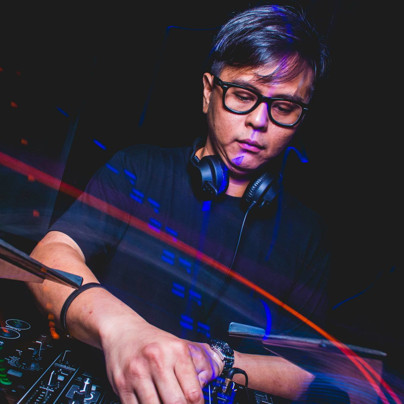 Malaysian DJ and producer Terence C performing at an event, colour image.