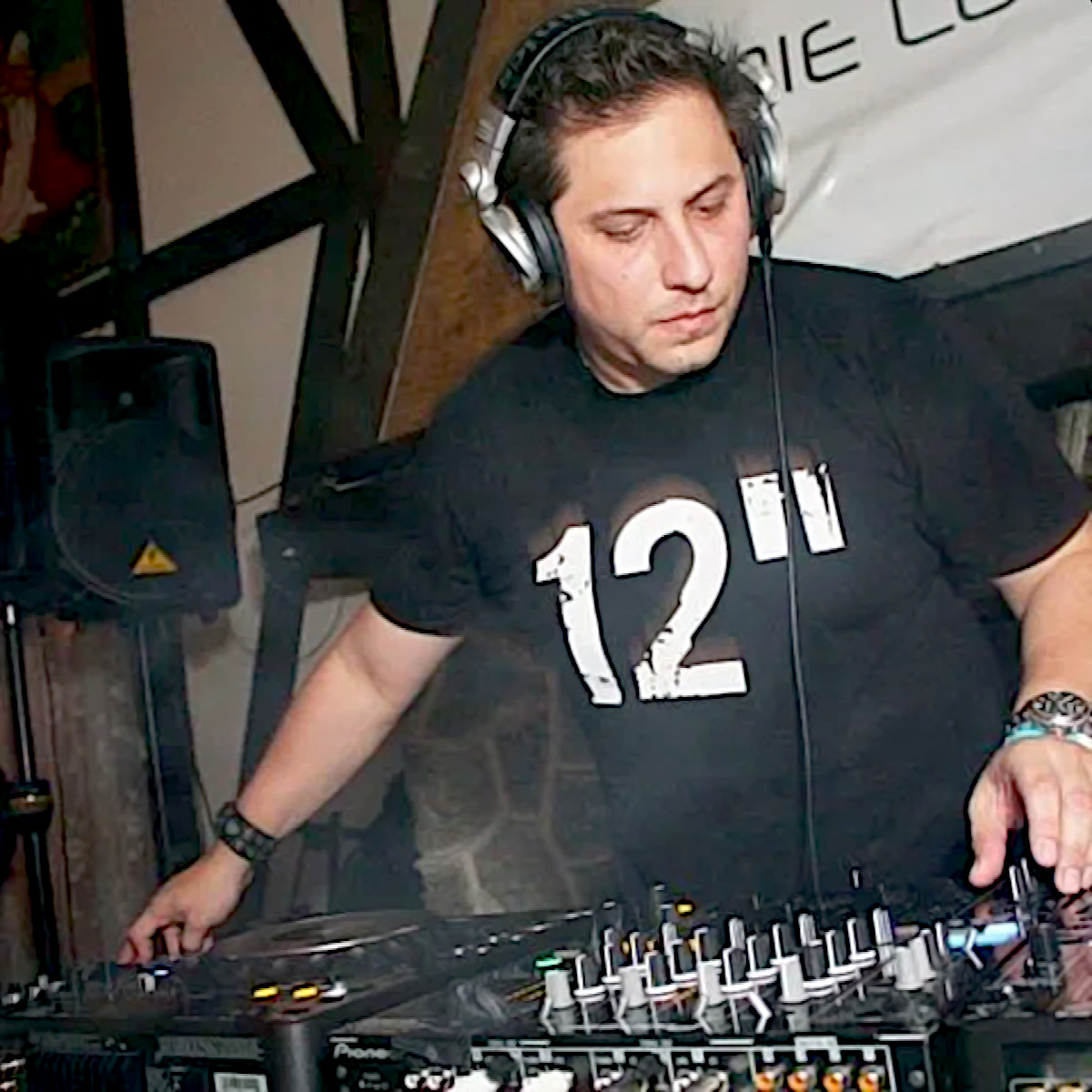 American dJ and producer Eddie lopez performing at an event using Pioneer DJ equipment, colour image.