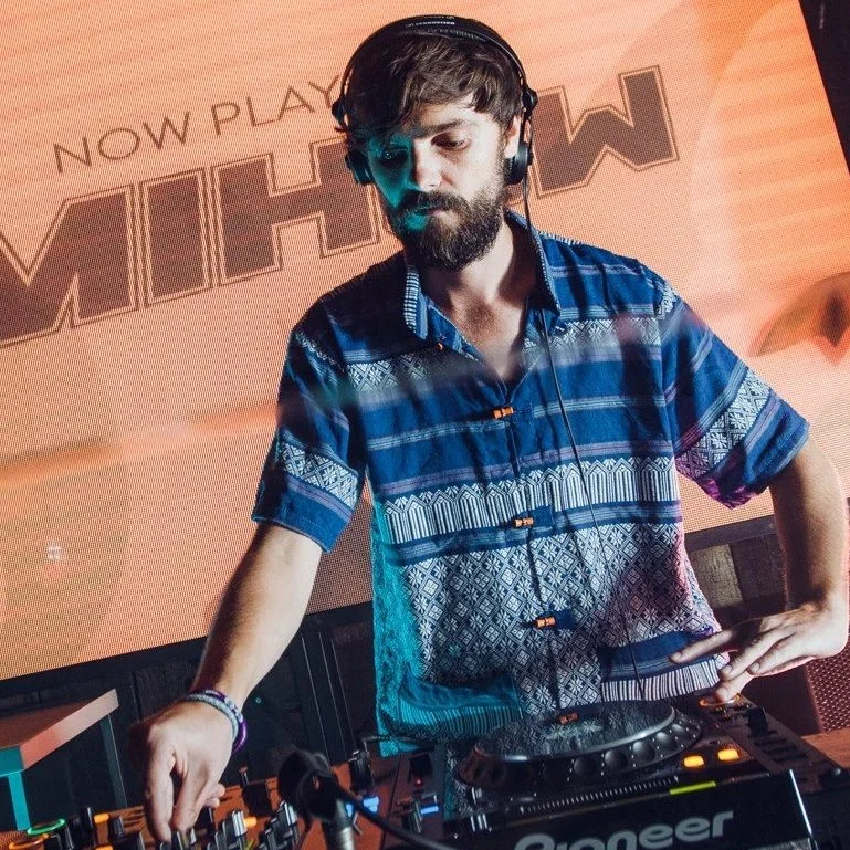 Australian DJ and Producer Mihow performing at event with Pioneer CDJs, colour image.
