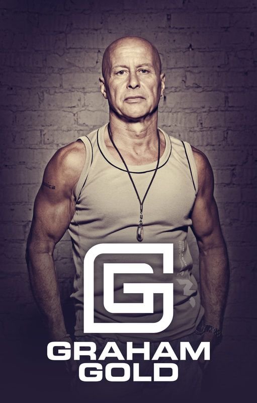 Former DJ magazine Top 100 DJ Graham Gold Standing with hands in pockets above his logo.