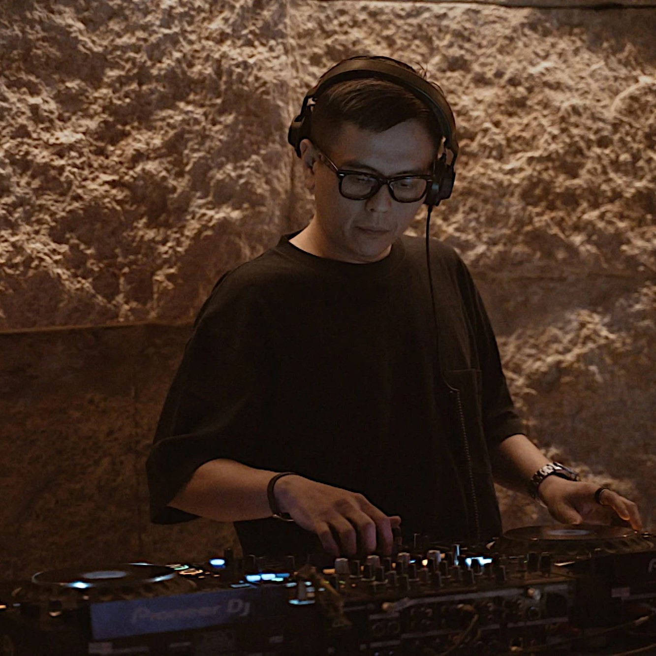 Malaysian DJ and producer Terence C performing at an event, colour image.