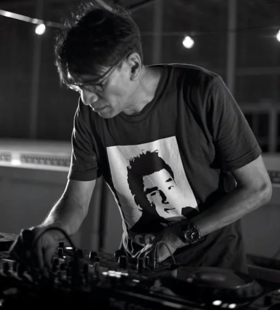 Singaporean DJ and producer Brendon P performing at at event in side picture, black and white image.