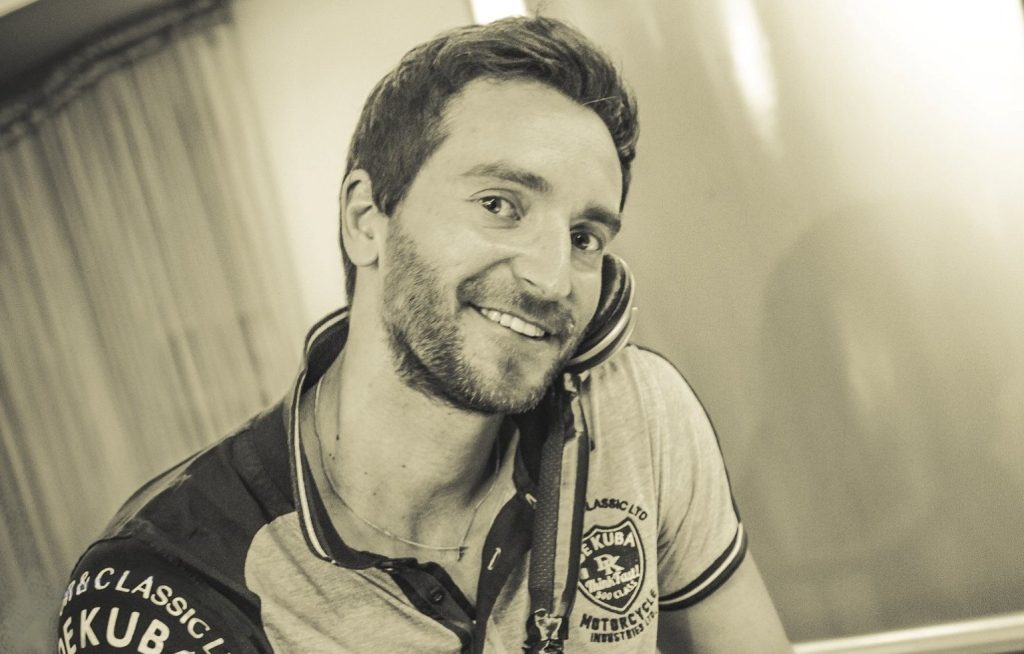 Italian DJ and producer INVE performing as a DJ at iBar, black and white image.