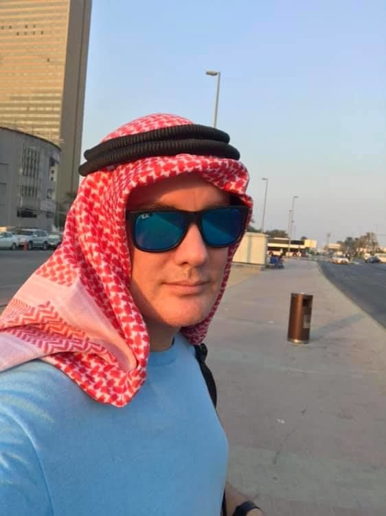 DJ Andrew M wearing Arab Headdress.